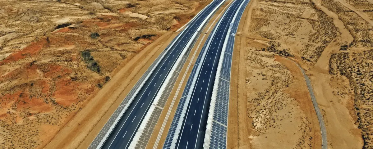 Aerial view of a divided highway through arid terrain