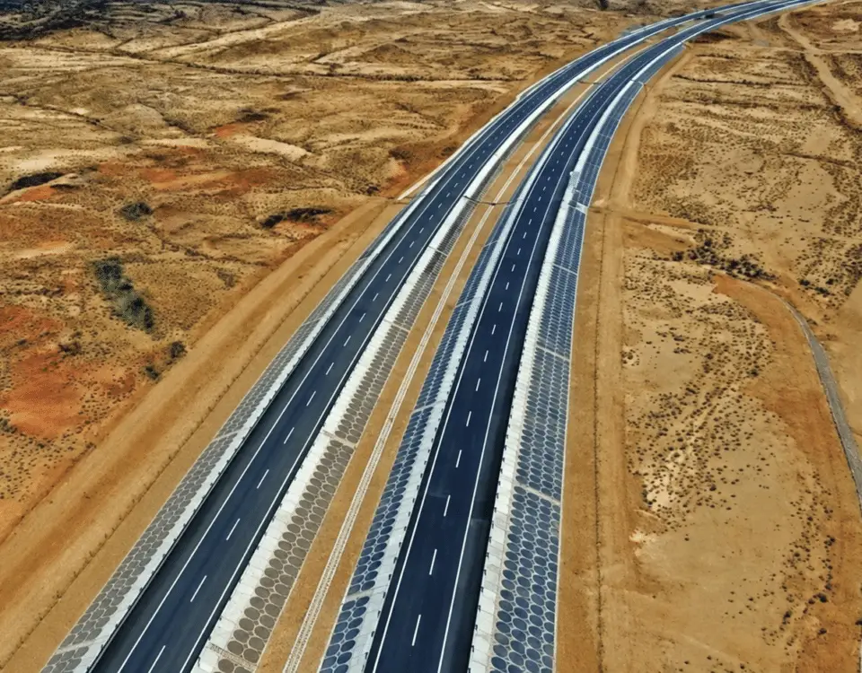 Aerial view of a divided highway through arid terrain