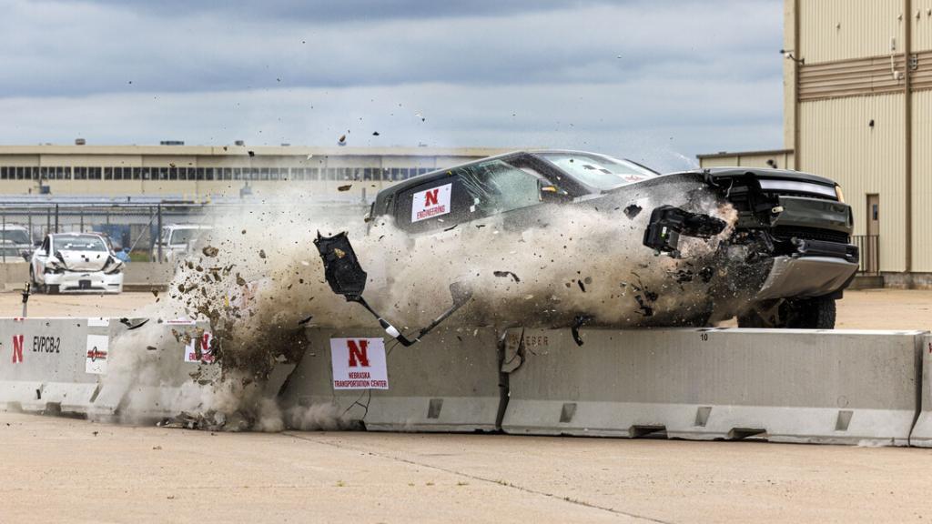 Rivian R1T colliding with a concrete roadside barrier during a University of Nebraska–Lincoln crash test.